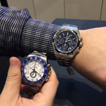 Vacheron Constantin Overseas Chronograph in Stainless Steel (42.5mm) next to a Rolex Yacht-Master II in Stainless Steel (44mm) for size comparison.